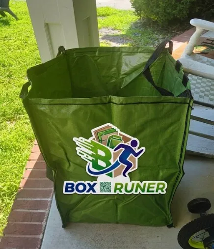 An empty Box Runner tote set out on a porch, ready to fill